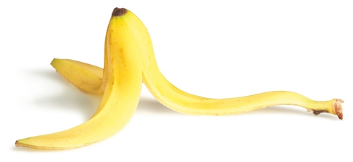 slippery banana skin on a white background